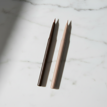 Duo Slim Retractable Eyebrow Pencil - Blonde Beige variant, two pencils on white marble