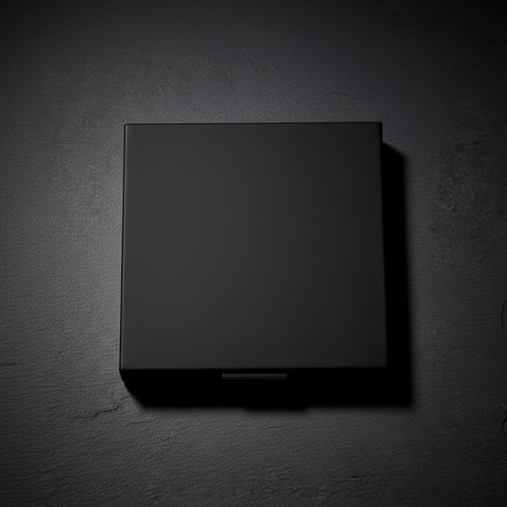 Obsidian Nine-Pan Palette matte black square compact closed, overhead flat lay on dark slate