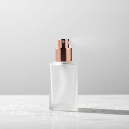 Close-up of rose gold fine mist pump nozzle with spray mist effect on white background