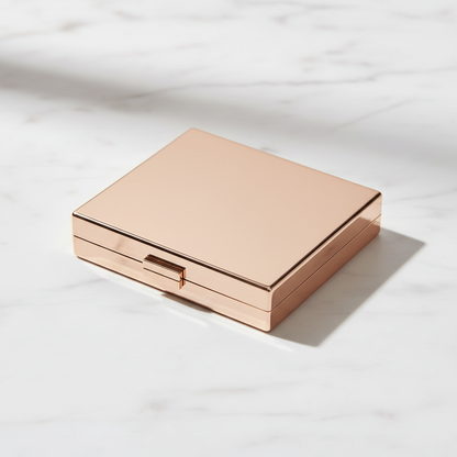 Velvet Quad Eyeshadow Palette rose gold compact closed, angled side view on marble