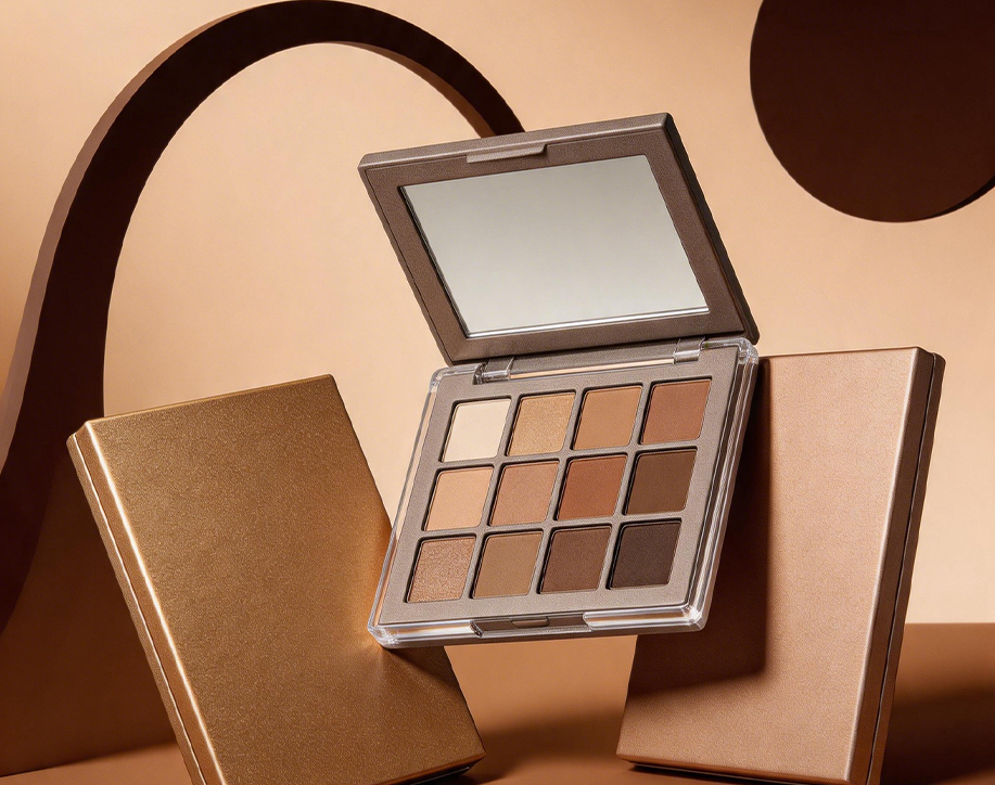 Makeup palette with a mirror on a brown background